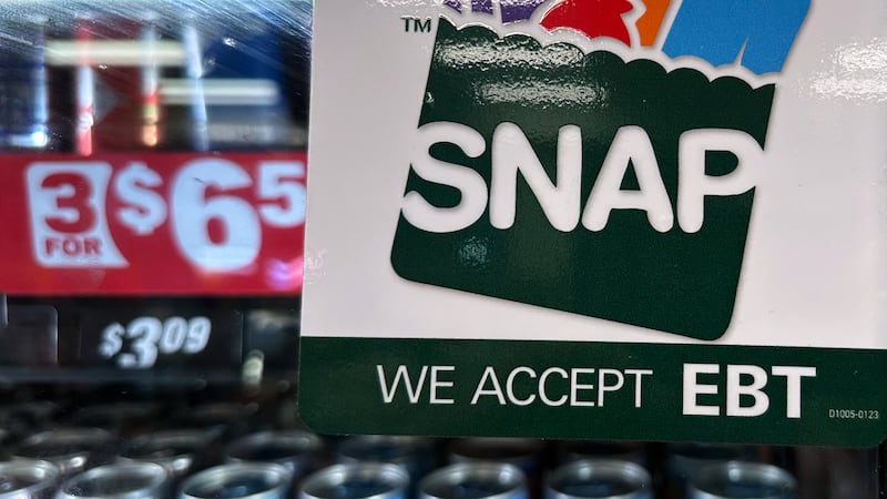 FILE - A SNAP EBT information sign is displayed at a gas station in Riverwoods, Ill., Nov. 1,...