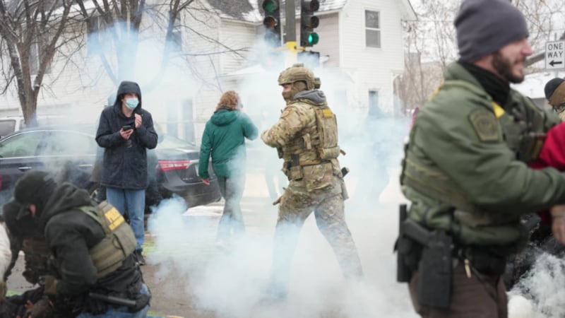 Tear gas is deployed as Federal agents make arrests on Wednesday, Jan. 21, 2026, in...