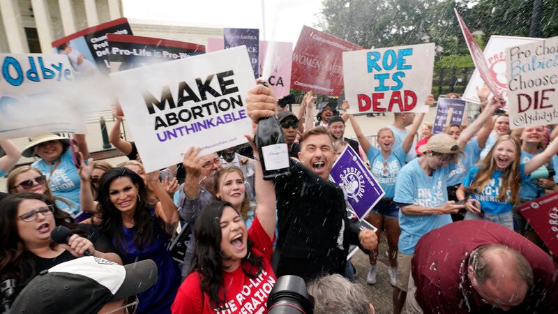 A celebration outside the Supreme Court, Friday, June 24, 2022, in Washington. The Supreme...