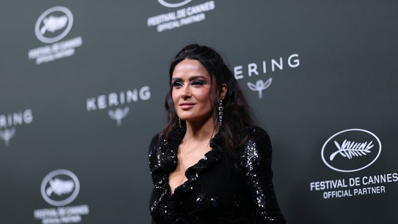 Salma Hayek poses for photographers upon arrival at the Kering Women In Motion Awards during...