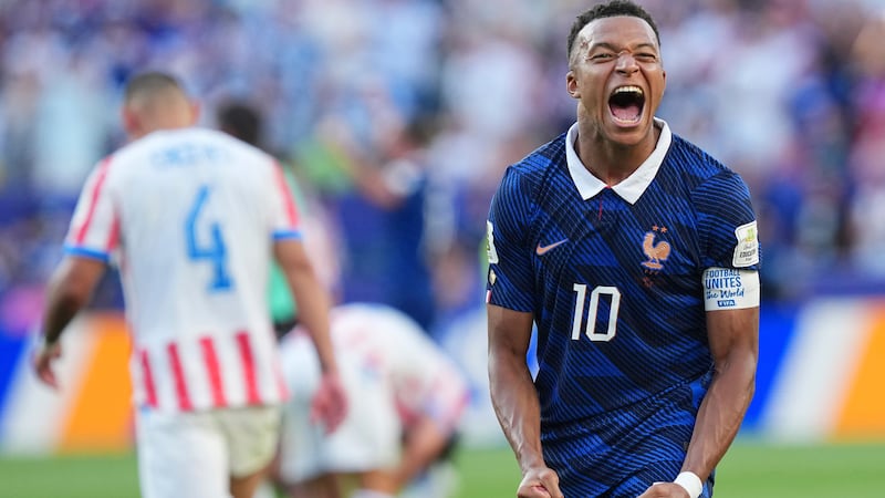 France's Kylian Mbappe (10) celebrates his team victory at the end of the World Cup round of...