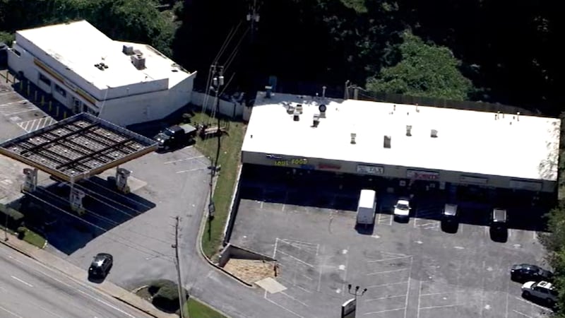 Police said they are investigating the death of a person at a south Atlanta strip mall Monday.