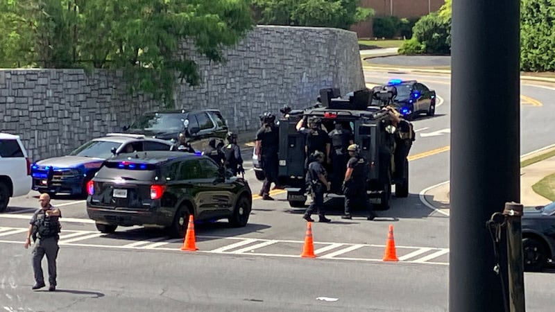 A manhunt is underway for a murder suspect on Windy Hill Road in Cobb County on Tuesday...