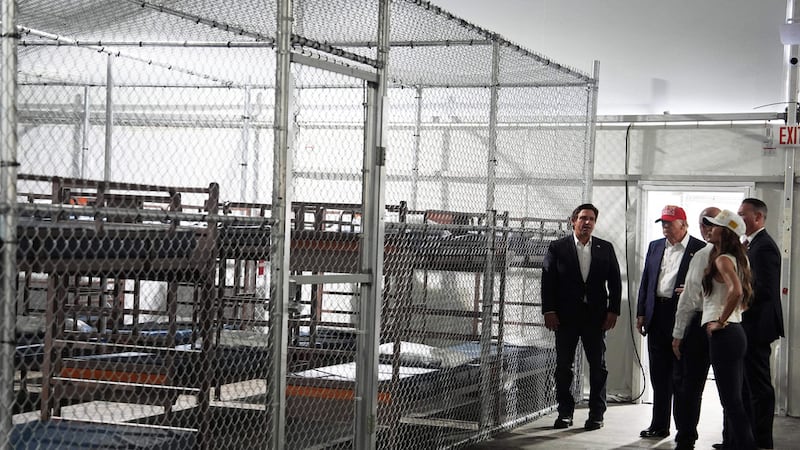 FILE - President Donald Trump, Gov. Ron DeSantis, R-Fla., and Homeland Security Secretary...