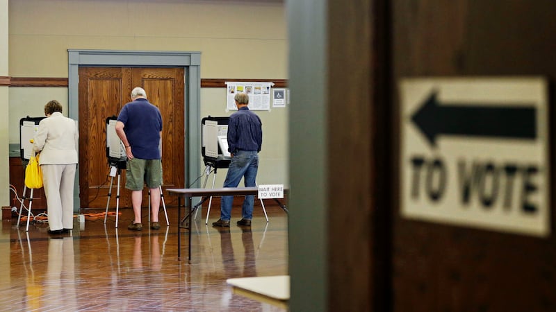 Voters cast their ballots at a polling site for Georgia's primary election, Tuesday, May 20,...