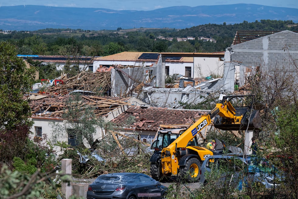 Damaged houses are pictured after a tornado ravaged the small village of Pomas in southern...