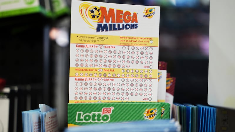 FILE - Mega Millions Lottery play slips are displayed for customers at a convenience store in...