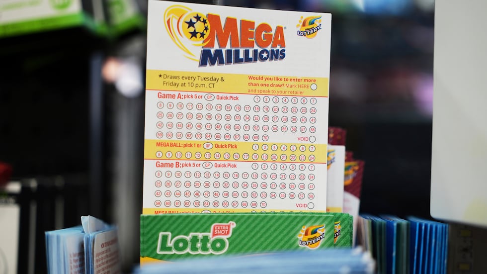 FILE - Mega Millions Lottery play slips are displayed for customers at a convenience store in...