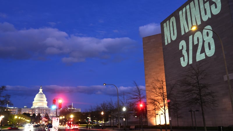 A message promoting an upcoming "No Kings" protest is projected on the National Gallery of...