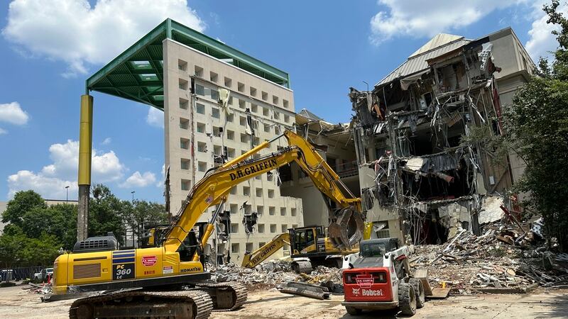 ARCHIVO | Workers knock down a former Coca-Cola Co. museum in downtown Atlanta on Friday, May...
