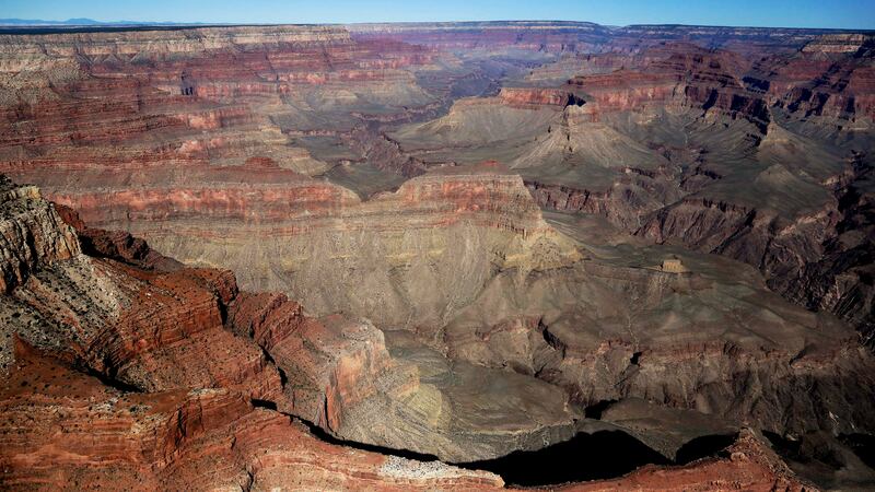 FILE - Grand Canyon National Park is covered in the morning sunlight as seen from a helicopter...