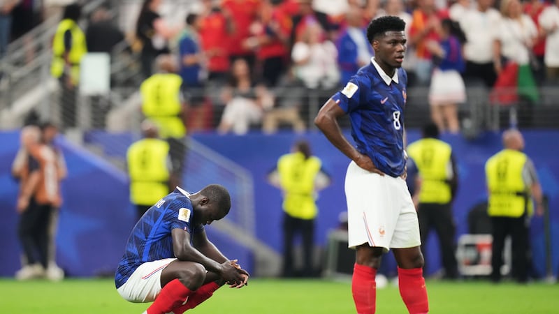 France's Dayot Upamecano, left, and Aurelien Tchouameni (8) stand dejected after the World Cup...