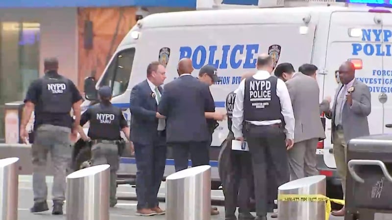 This image made from video provided by WABC shows NYPD officers on the scene after a woman...