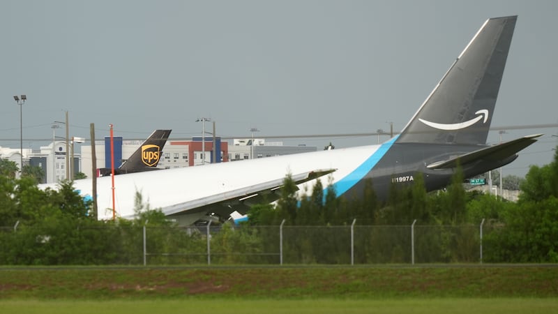 An Amazon cargo plane sits at the Miami International Airport (MIA) after it overshot the...