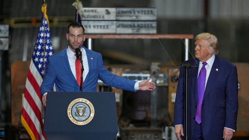 Congressional candidate Clay Fuller speaks as President Donald Trump listens at a rally at...