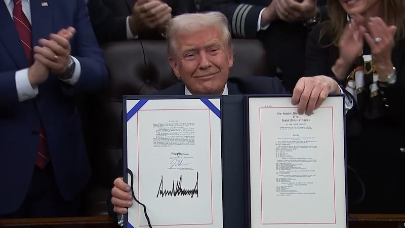 The signing ceremony came just hours after the House passed the measure on a mostly party-line...