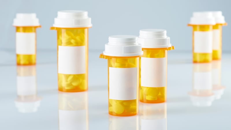 FILE - pill bottles