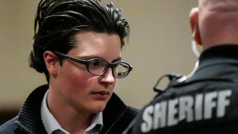 FILE - School shooting suspect Colt Gray exits the Barrow County Courthouse, Dec. 9, 2025, in...