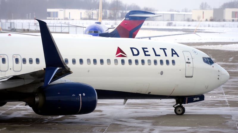 A Delta Airlines jet pulls away from a gate at Pittsburgh International Airport in Imperial,...